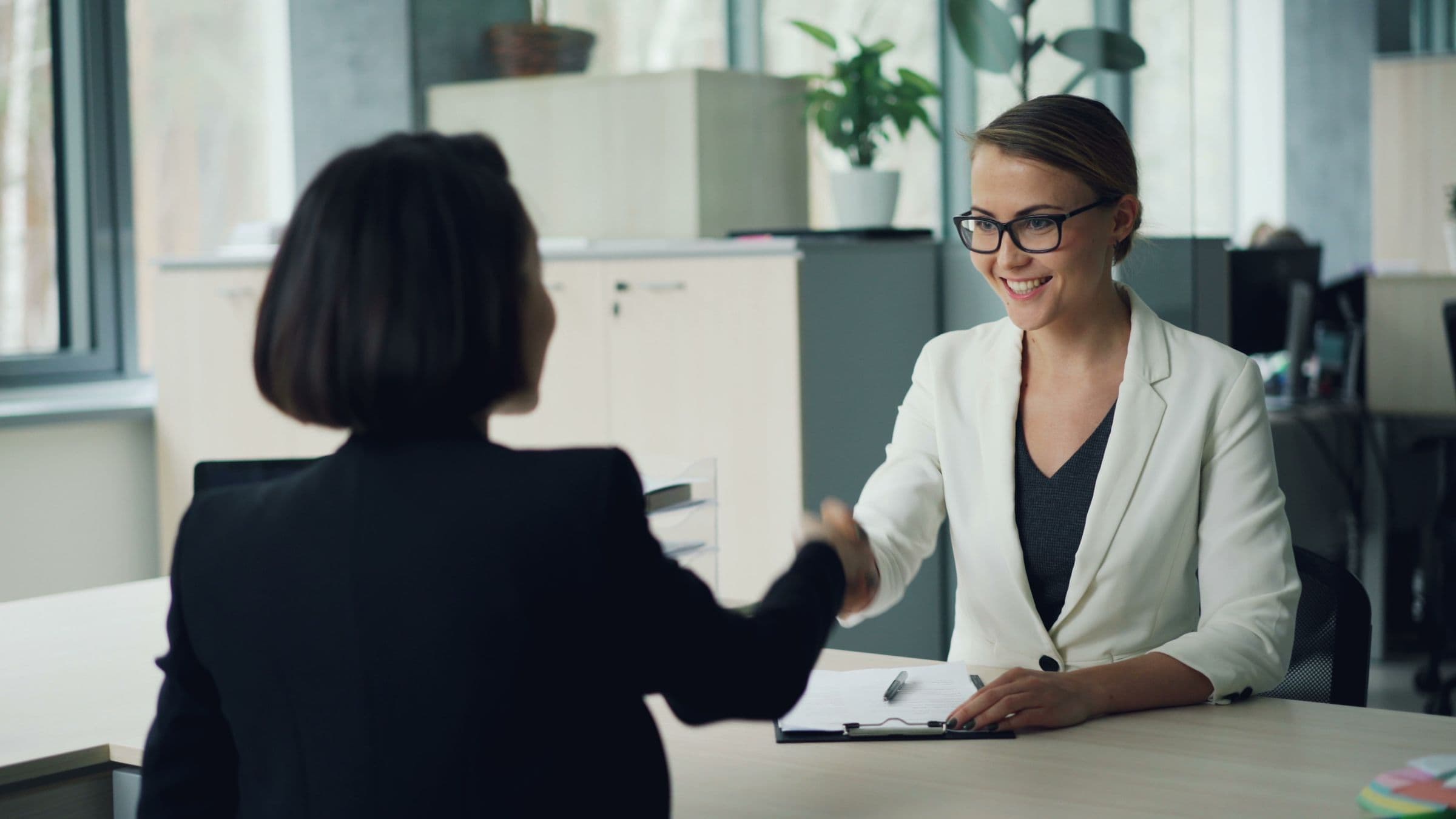 Travel specialist speaking with a client