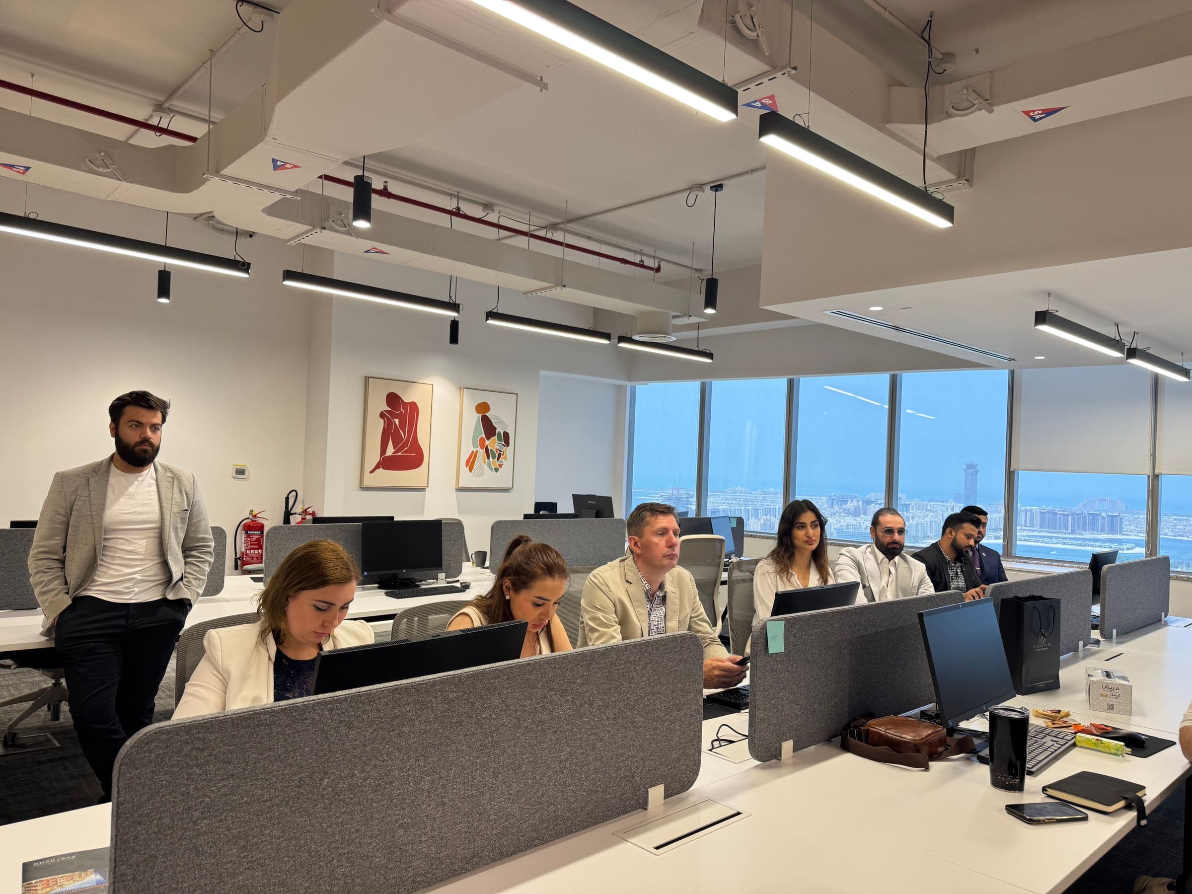 A diverse travel management team working together in Dubai
